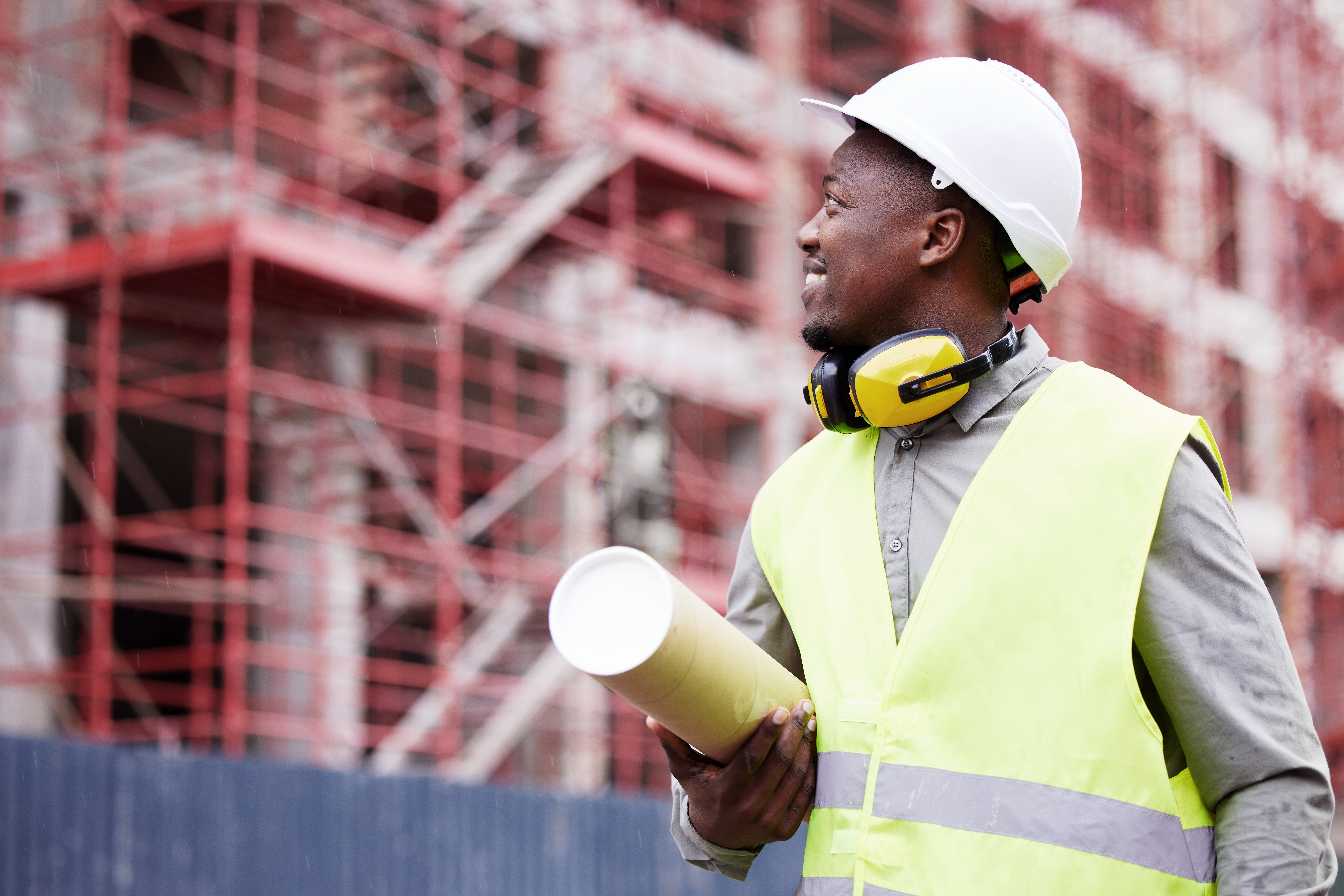Cropped shot of a handsome young construction worker standing on a building site